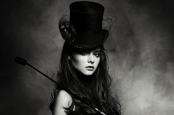 young woman with top hat on